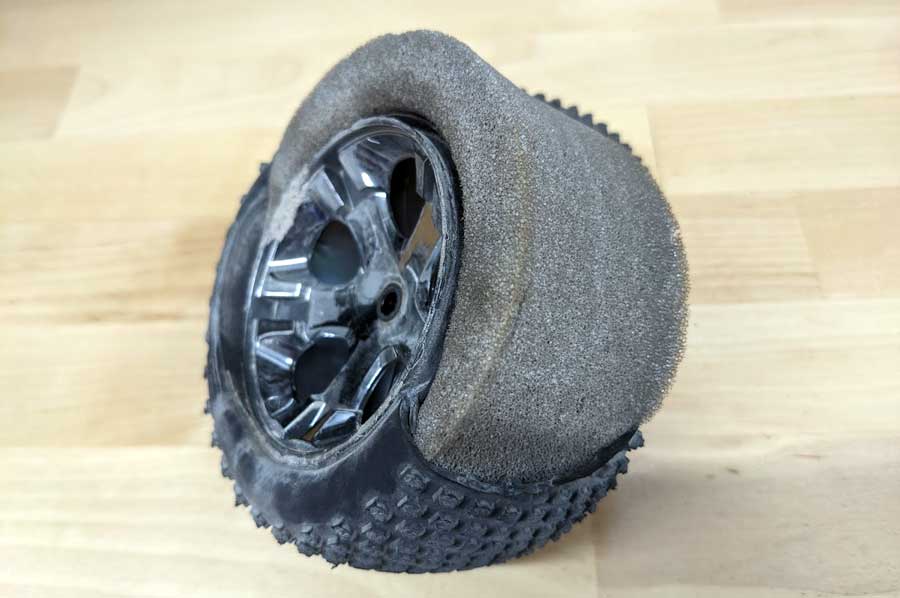Blown tire with foam insert showing
